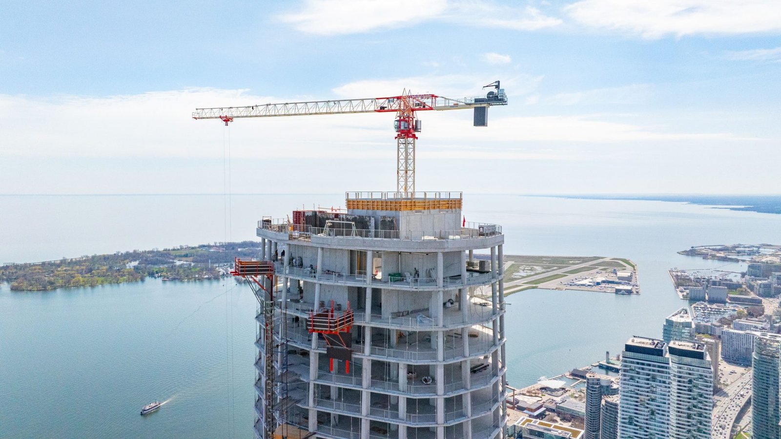 Crane over a tower during glazing work